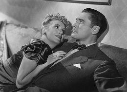 Бренда Маршалл в роли Риты Уоррен и Флинн в роли Фрэнсиса Уоррена («Шаги в темноте», 1941)
