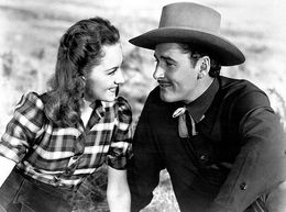 Флинн в роли шерифа Хаттона и Оливия де Хэвилленд в роли Эбби Ирвинг («Додж-сити», 1939)