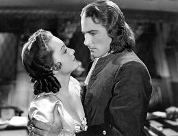 Флинн в роли капитана Блада и Оливия де Хэвилленд в роли Арабеллы Бишоп («Одиссея капитана Блада», 1935)
